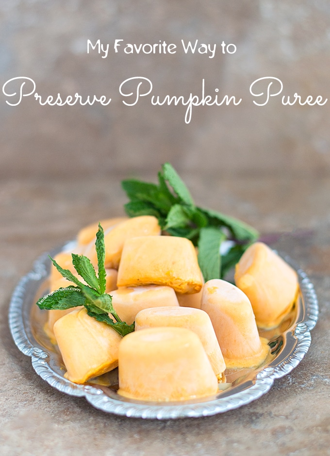 Front View of Pumpkin Puree Ice Cubes on a Silver Tray with Mint Leaves for Garnish - How to Preserve Pumpkin Puree