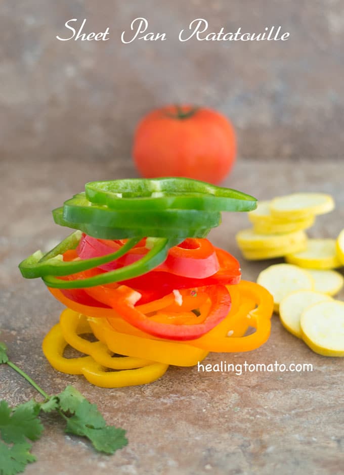 Front View of All Colors of Bell Peppers Cut Into Rings and Stacked on Top of Each otehr - Sheet Pan Ratatouille