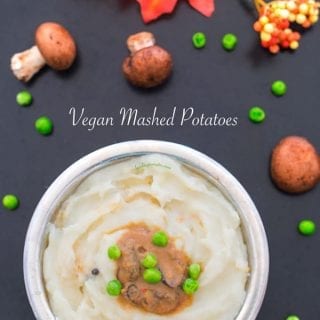Overhead view of vegan mashed potatoes with gravy and peas in the middle - Vegan Dumplings Soup