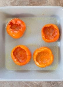 Four Persimmons Scooped Out and Placed on a Baking Dish