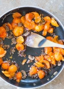 Persimmons Pulp in the pan with Mushrooms and Onions