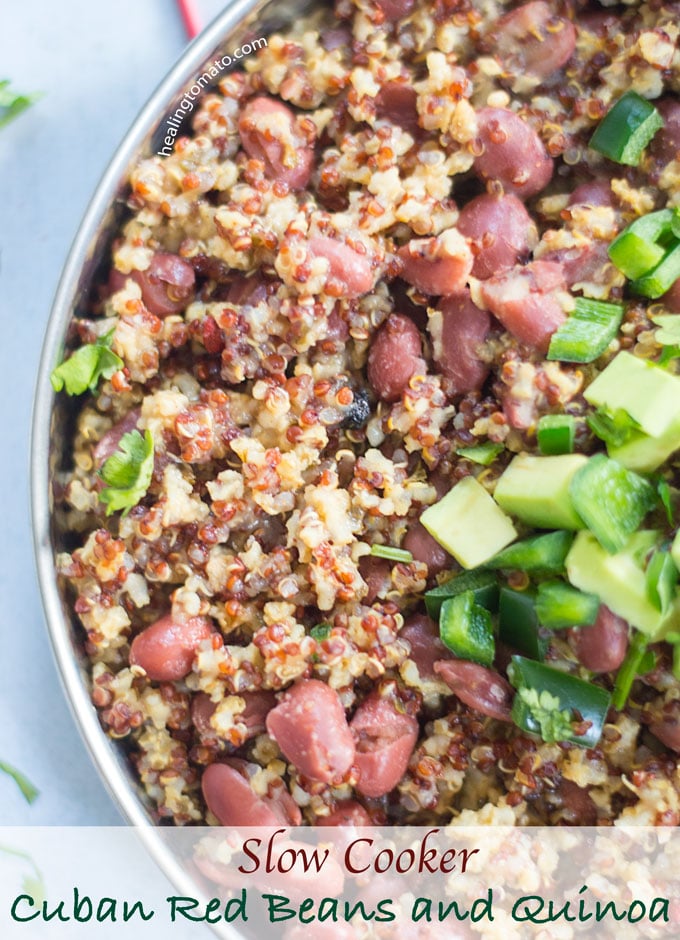 Overhead view of vegan quinoa and red beans recipe garnished with avocado + Jalapeno. Cuban Seasoning