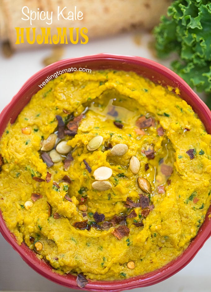 Closeup View of a White Tray with a red bowl in it. Bowl contains Spicy Kale Hummus