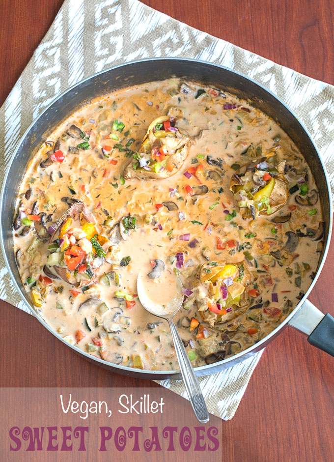 Overhead view of a skillet filled with creamy sauce and veggies
