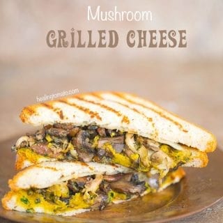 Front View of two Mushroom Grilled Cheese cut into Triangle shapes.