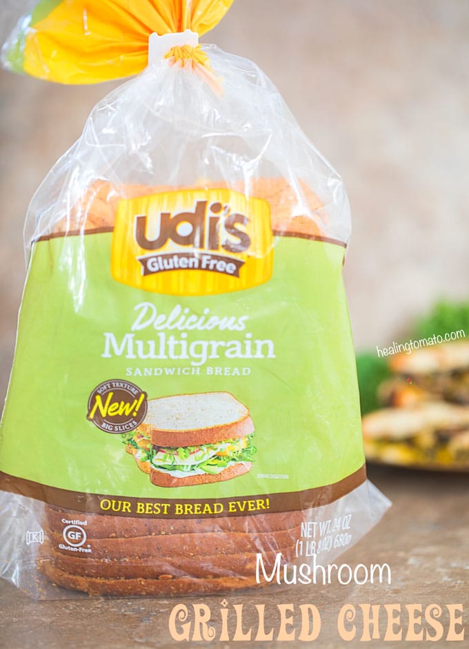 Front view of a loaf of UDI's Multigrain bread and 2 grilled cheese sandwiches