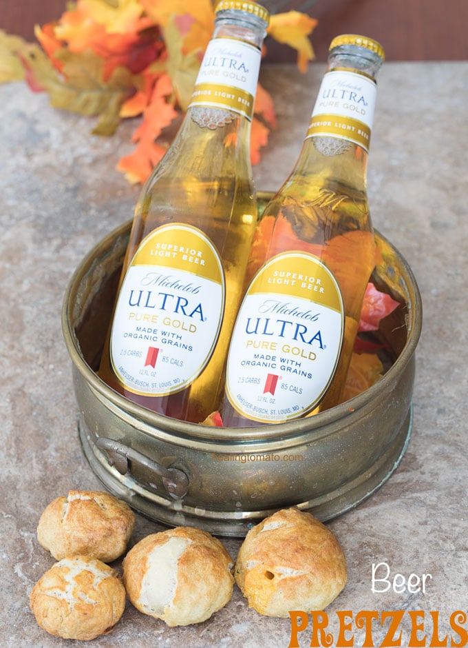 Beer Pretzel Bites sitting next to a bronze container with Michelob ULTRA Pure Gold Beer
