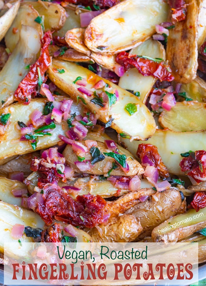 Closeup view of the roasted fingerling potatoes mixed with sun-dried tomatoes, oregano and red onions