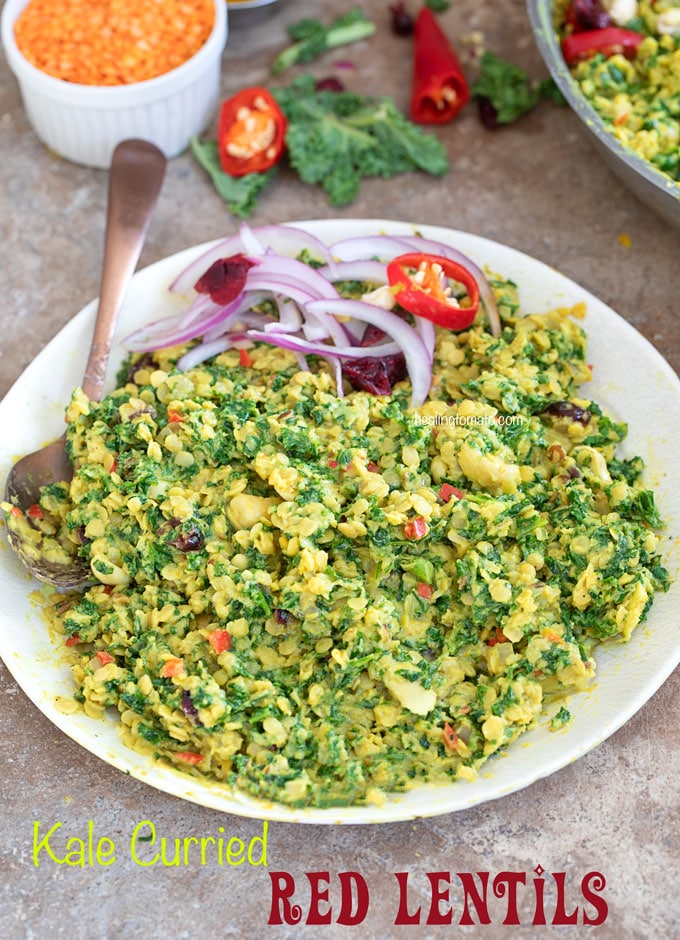 Front view of kale curried red lentils in a white plate