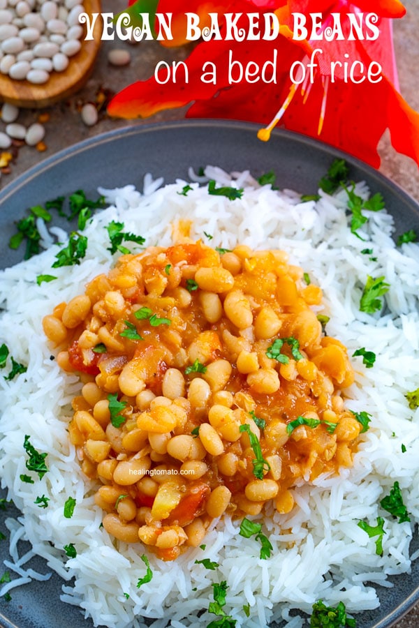 Slow Cooker vegan baked beans on a bed of white rice on a grey plate and garnished with cilantro