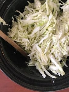 shredded cabbage added to the slow cooker - Cabbage Curry