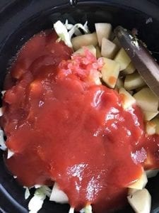 Tomato sauce added to the slow cooker - Cabbage Curry