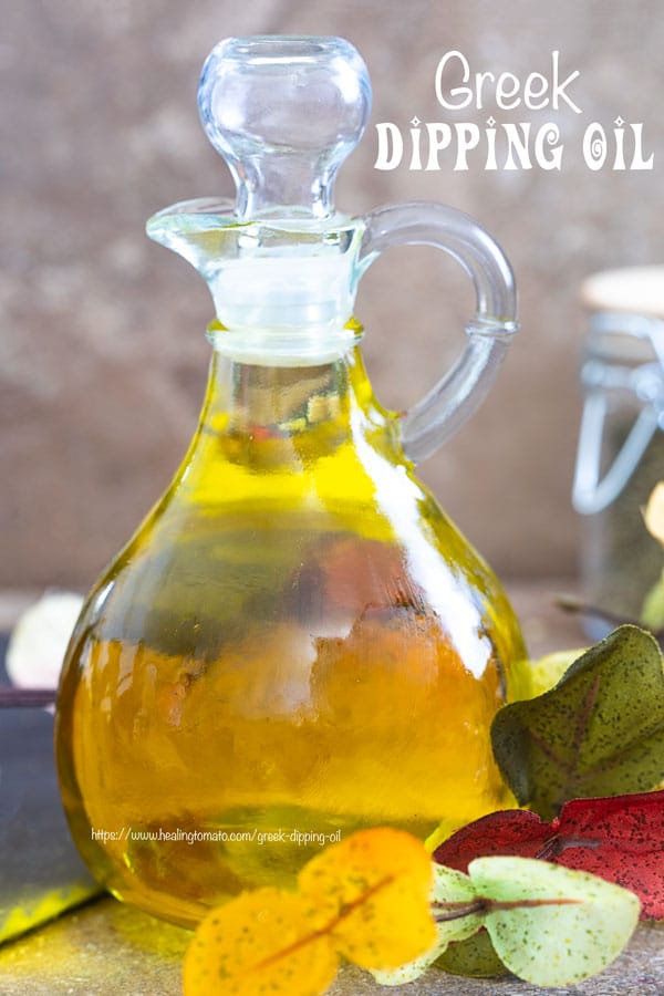 Front view of a glass olive oil bottle filled with Greek Extra Virgin Olive OIl - Greek Dipping oil