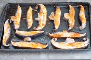 Portobello mushrooms on baking tray waiting to go into the oven - Vegan Taquitos