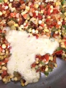 corn cream added to pan - how to make creamed corn