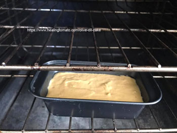 Bread pan in the lower rack in the oven- Vegan Pumpkin Olive Oil Cake