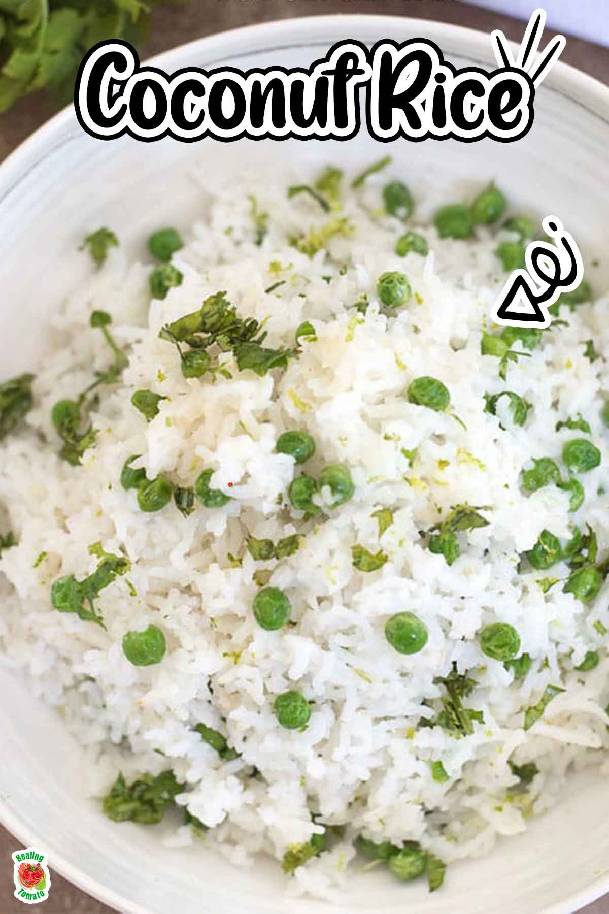 Top view of a white bowl filled with coconut rice and green peas.