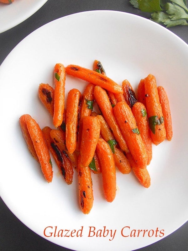 Roasted Carrots on a white plate - Thank Vegans