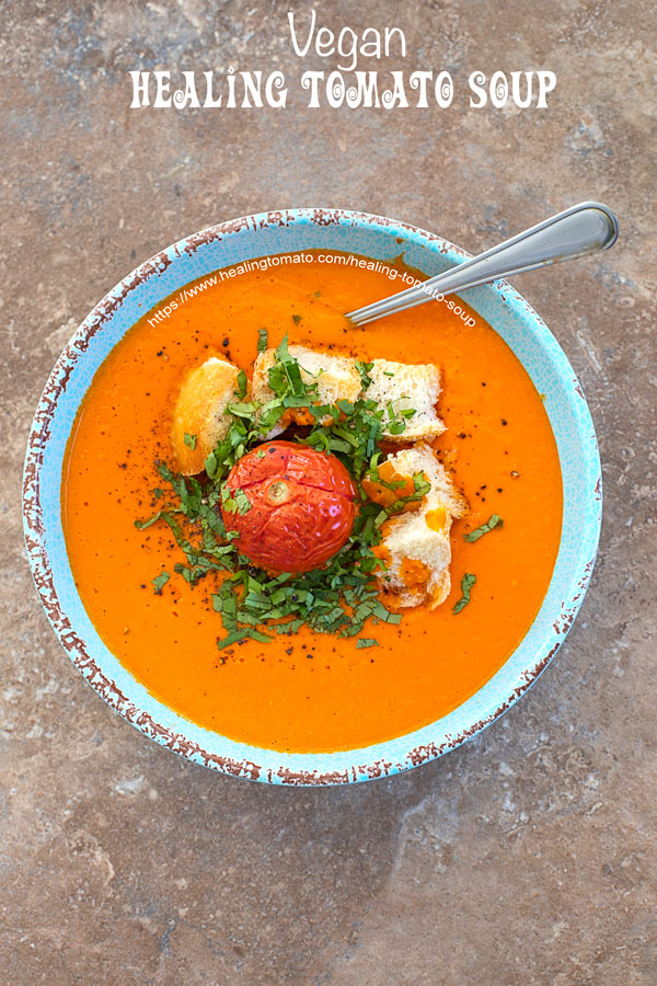 Overhead view of a blue bowl with healing tomato soup