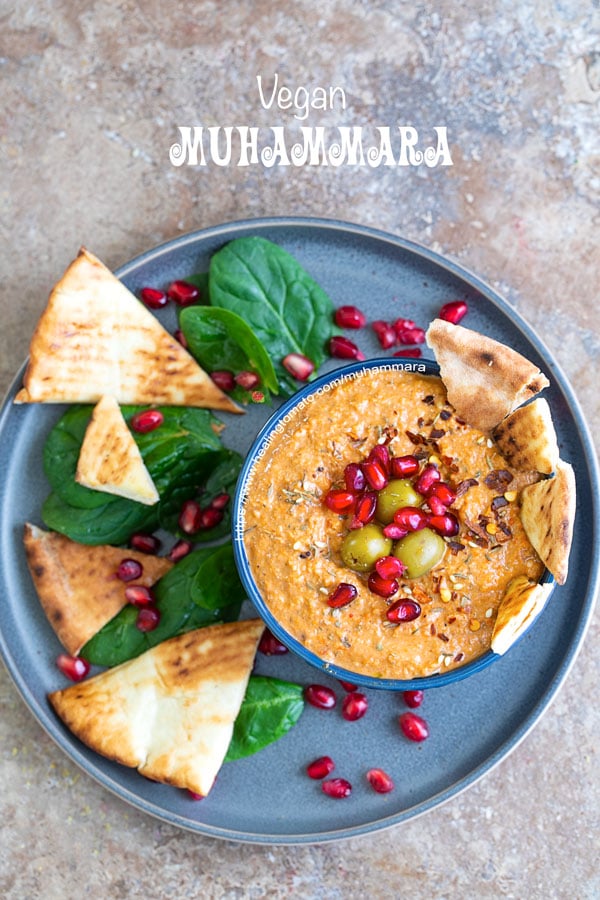 overhead view of muhammara in a bowl with pita chips