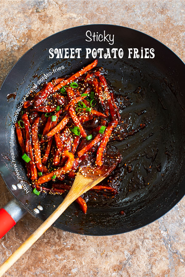 overhead view of sticky sweet potato fries in a jumbo wok