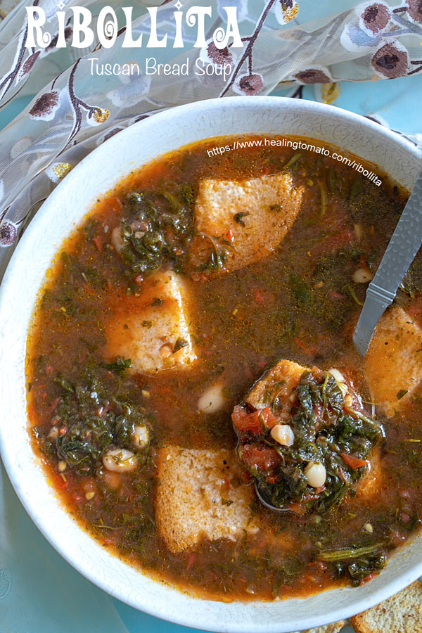 Overhead closeup of ribollita soup in a bowl with a spoon