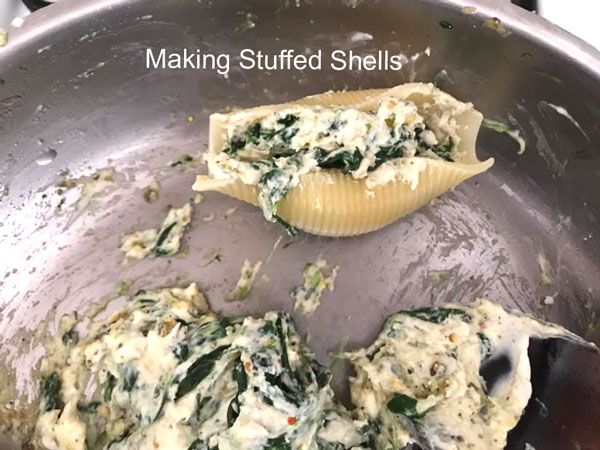 single stuffed shell next to the spinach stuffing