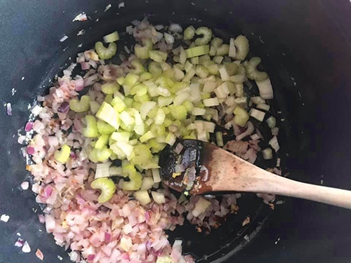 chopped celery added to the pan