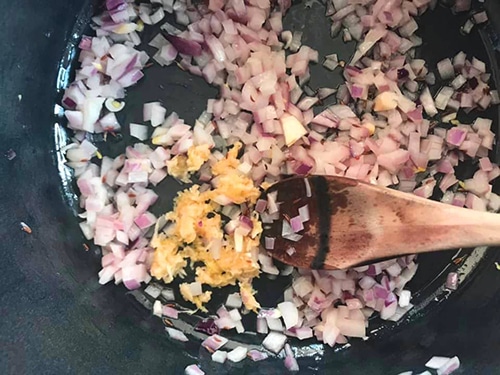 freshly grated garlic added to the onions