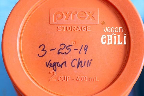 The lid of a small pyrex container with the date 3-25-19 written on it