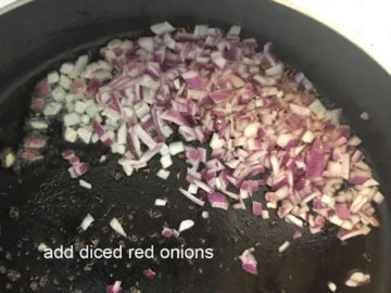 diced red onions added to the pan