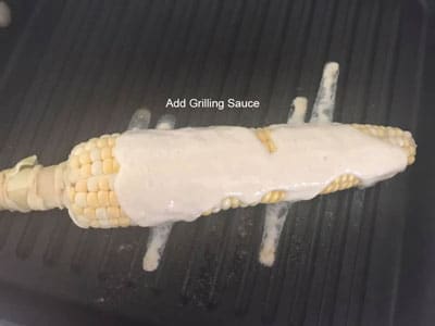 Tofu Grilling sauce poured on the corn