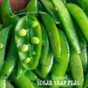 Top view of an open sugar snap pea pod with peas showing