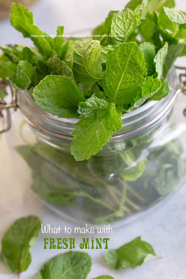 Closeup view of a mason jar filled with fresh mint