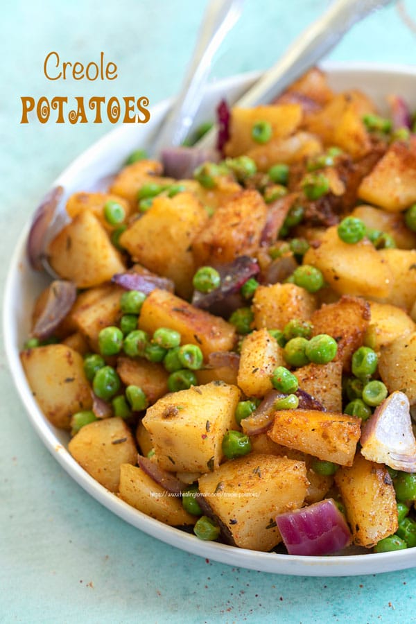 Angle and closeup view of potatoes and peas on a white plate