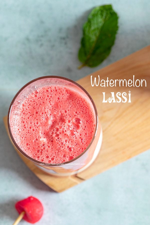 Overhead view of 3 small glasses filled with watermelon sweet lassi and a yogurt layer at the bottom