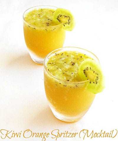Front view of a small glass filled with kiwi mocktail and one glass in the back