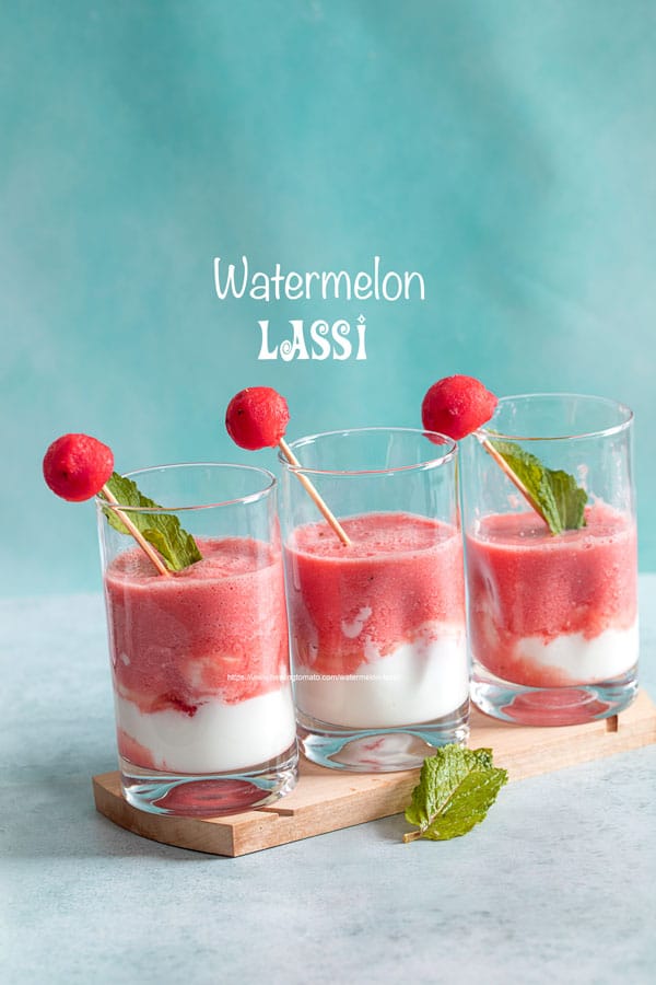 Front view of 3 small glasses filled with watermelon lassi and a yogurt layer at the bottom