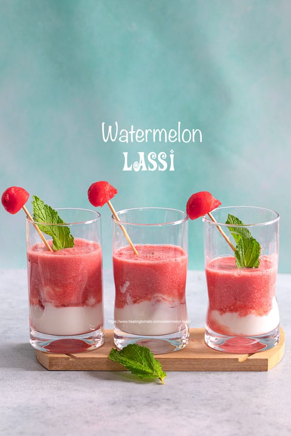 Front view of 3 small glasses filled with watermelon lassi and a yogurt layer at the bottom