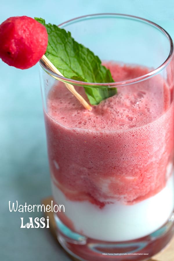 Front view of 1 small glass filled with watermelon sweet lassi and a yogurt layer at the bottom