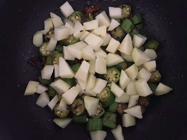 potatoes added to the fry pan with okra