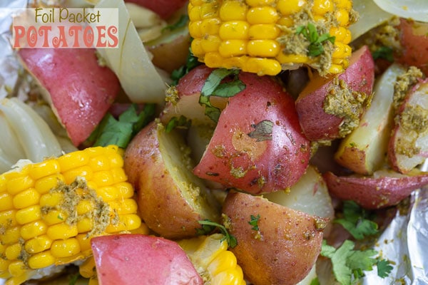 Close up of foil packet potatoes and corn