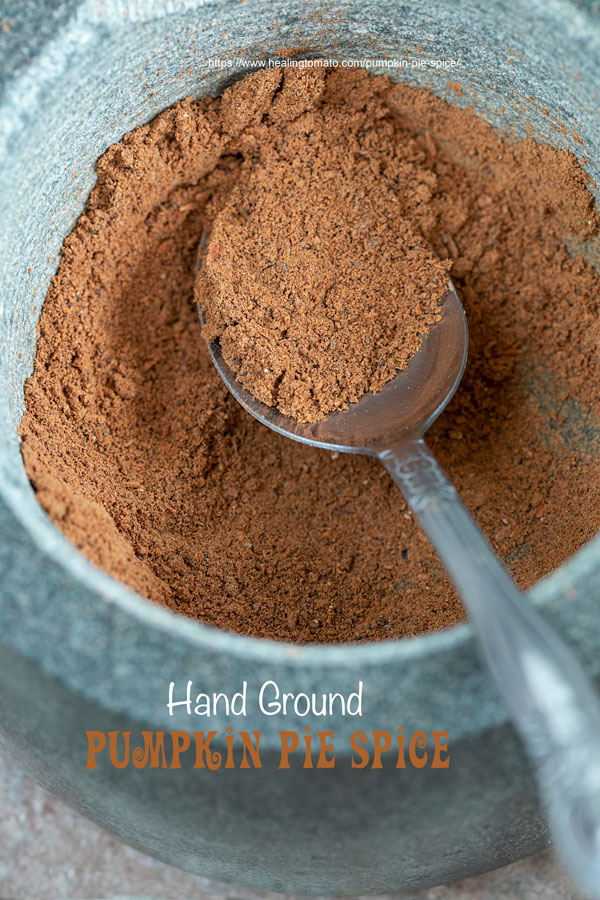 closeup view of ground pumpkin pie spice in a mortar and pestle