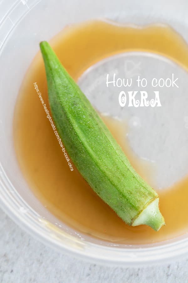 Top view of one okra soaking in apple cider vinegar