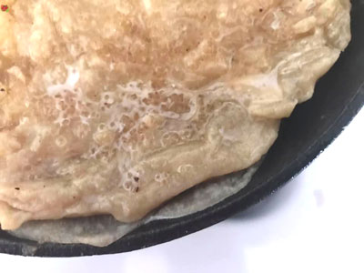 melted butter over pie crust
