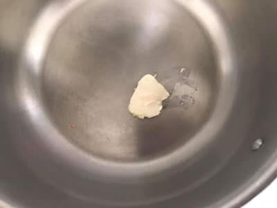 butter melted in a stainless steel pan