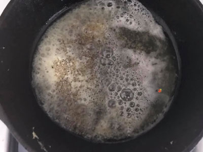 melted butter and sugar in cast iron pan