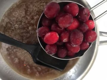 1 cup of frozen cranberries over the pan