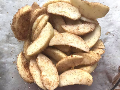 apple wedges mixed with all the spices and sugar