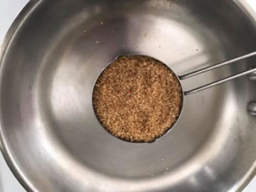 1 cup of demerara cane sugar over a stainless steel pan